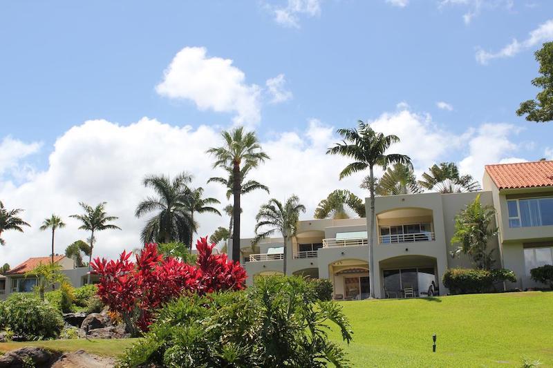 Rolling grounds in front of big windows provide beautiful Maui views